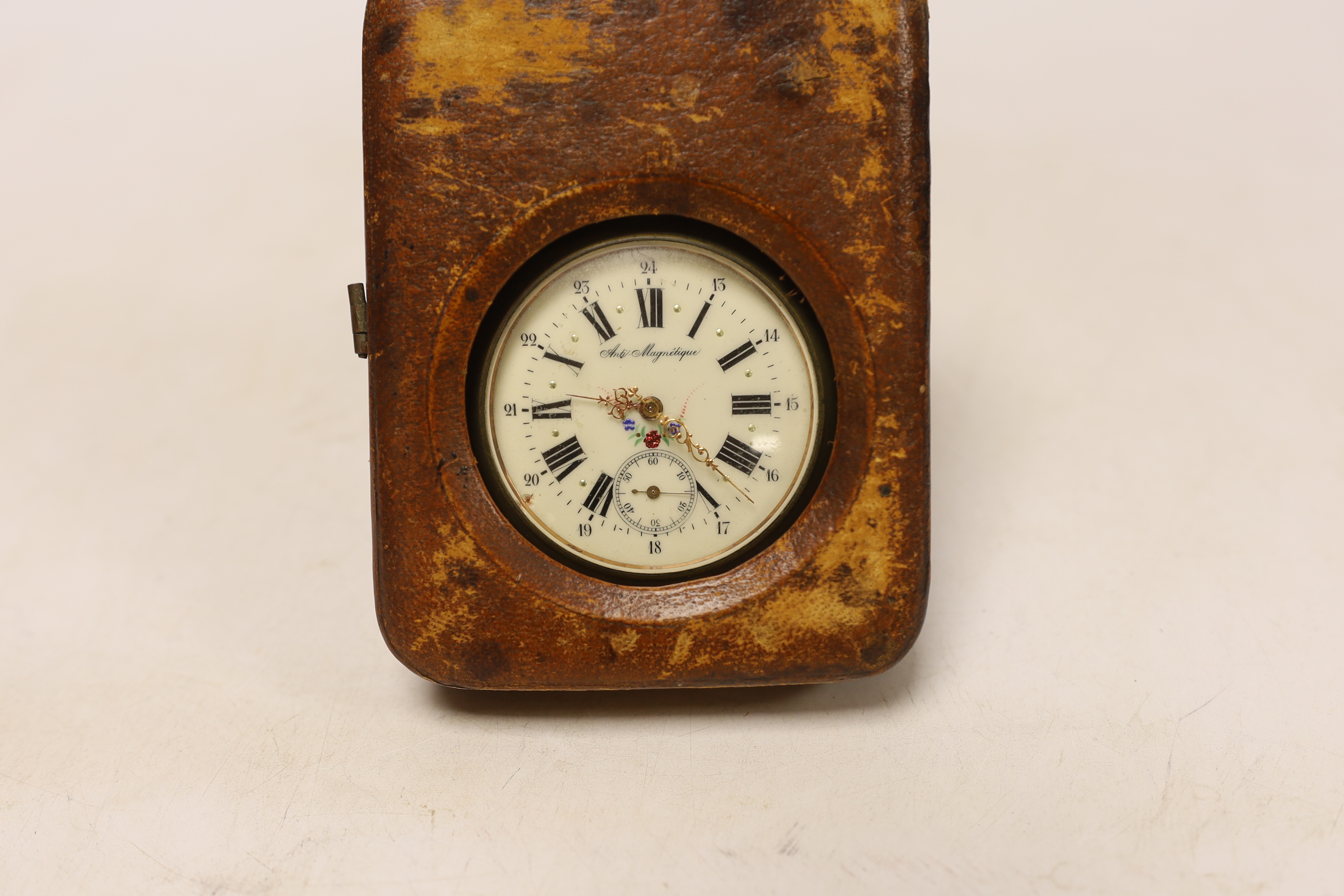An early 20th century French nickel cased keyless pocket watch, with Roman dial and subsidiary seconds, case diameter 65mm, in leather carrying case.